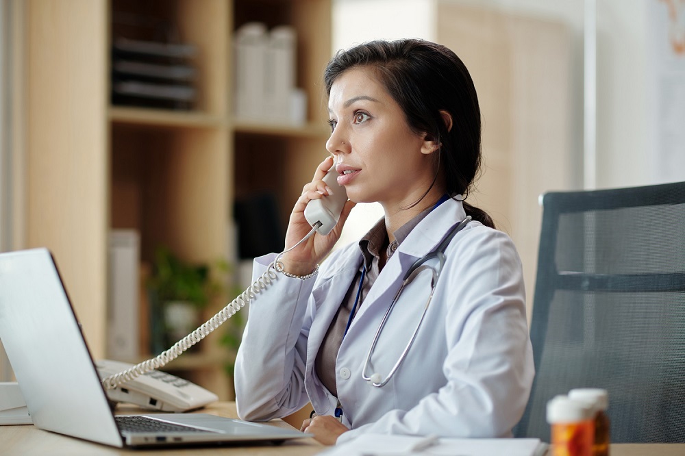 Physician Answering Phone Call
