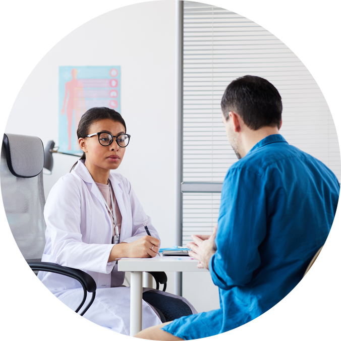 Urologist consulting patient in clinic