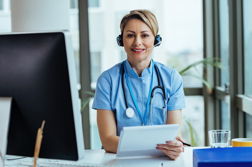 Female doctor wearing headset provides automated medical answering services