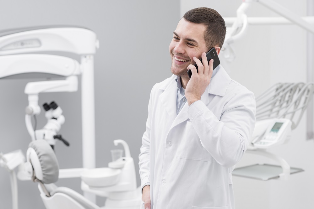 A dentist \ scheduling an appointment using medical answering service